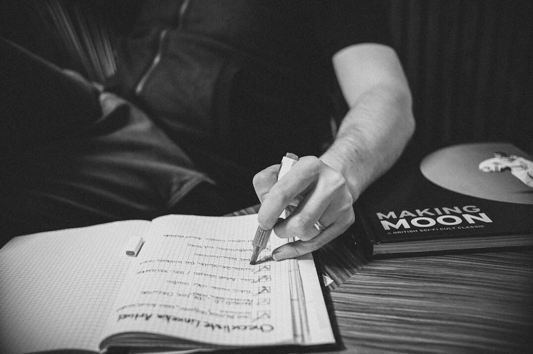 woman writing song lyrics