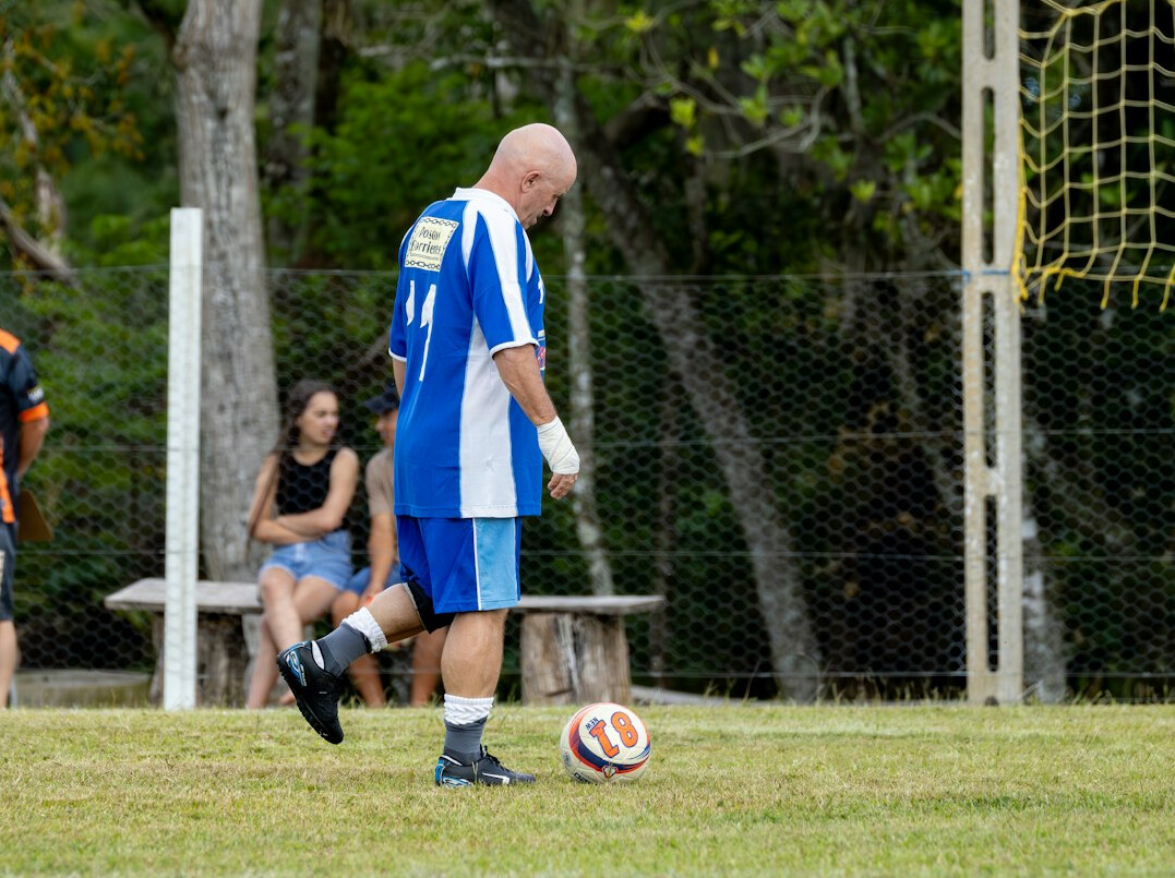 soccer coach on pitch
